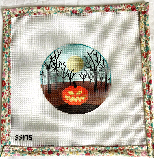 Jack o’lantern in forest